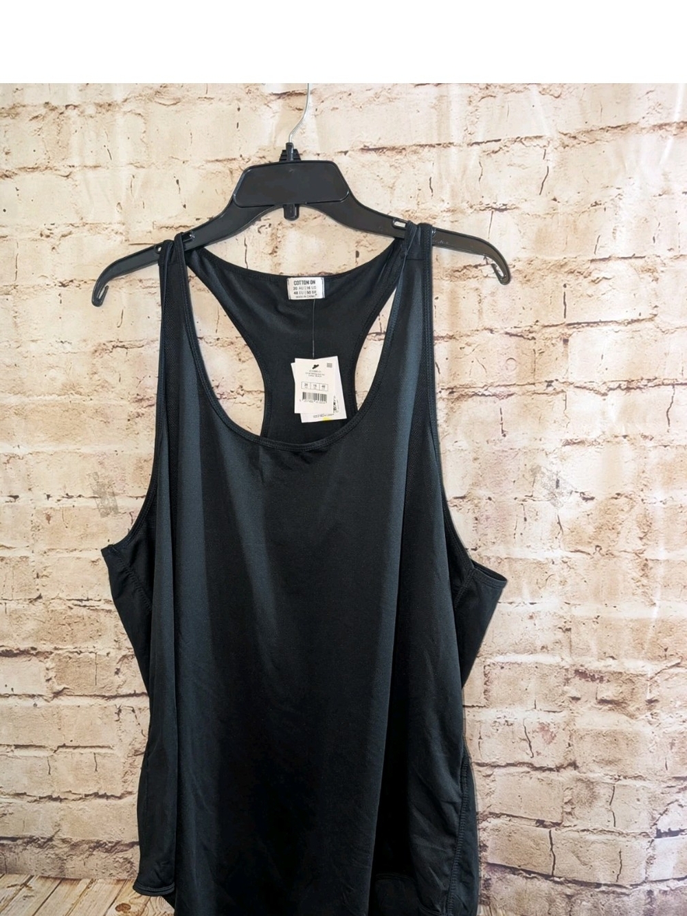 Cotton On women's black training tank top featuring a racerback Size 16